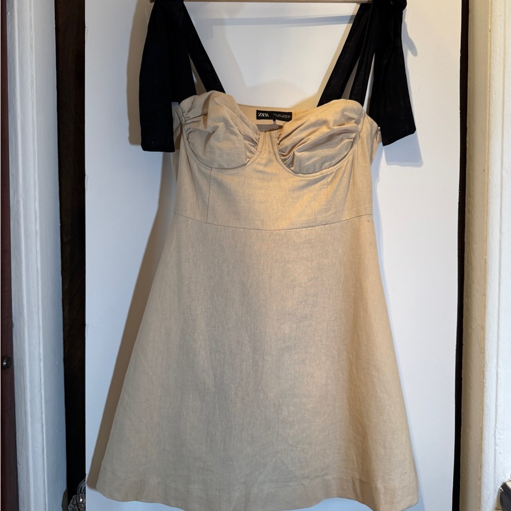 Elegant Beige Dress with Black Straps